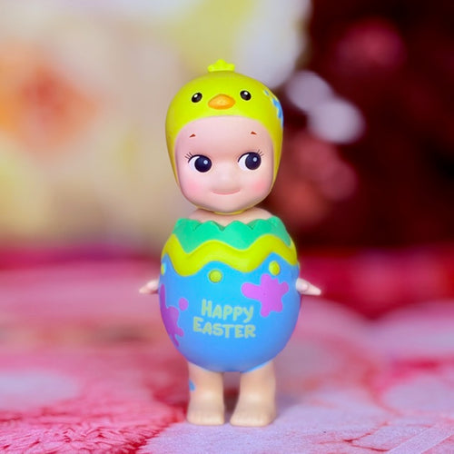 Easter collectible figure in purple hatching egg with green rim and 'Happy Easter' print