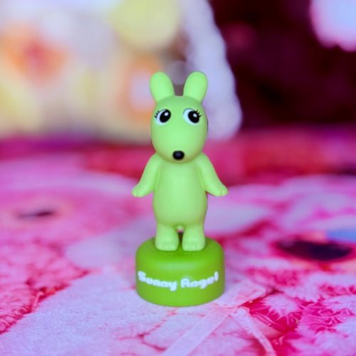 Green rabbit vinyl mini figure with large eyes; white text on base