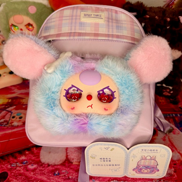 Kids plush backpack with fuzzy ears, front face patch, and plaid-top pocket