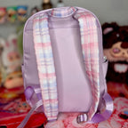 Lavender kids backpack with pink-and-blue plaid back panel and adjustable straps