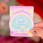 Wish Bear product card with pastel artwork and a clear character-shaped accessory
