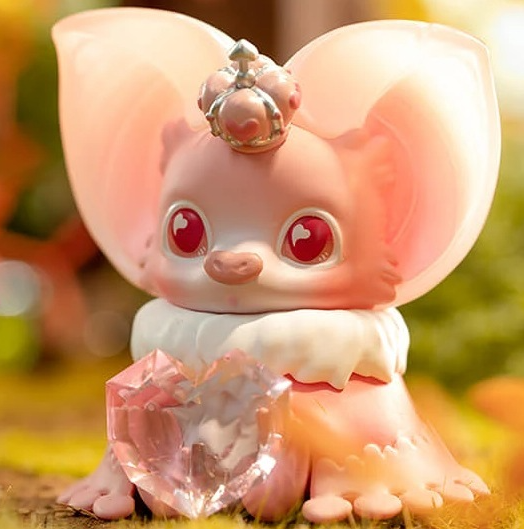 Peach winged collectible figure with tiara, red eyes, crouching beside pink crystal shards