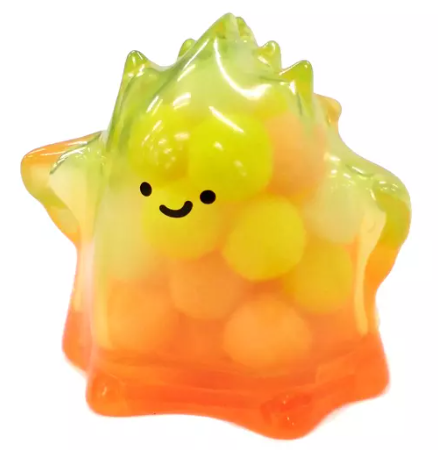 Transparent yellow-green jelly figure with smiling face and orange gradient base.